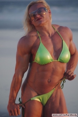 Amazing Muscle Babe posing outdoors