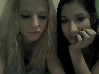 Brunette and blonde teen friends are playing on their webcam