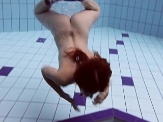 Smoking hot Russian redhead in the pool