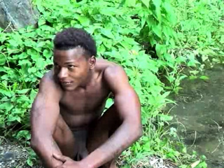 Brown soldier strips naked by the stream