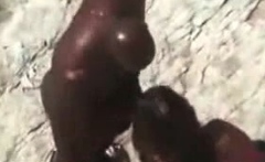 Big black dude fucking his white girlfriend at the beach