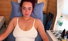 Busty curly brunette with big boobs fucks on couch