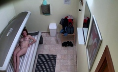 Young redhead in solarium
